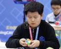 Main image for Chinese Speedcuber Shatters World Record With Mind-Blowing 0.39-Second Cube Solve.