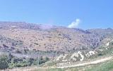 Main image for Hezbollah missile lands in open field in northern Israel amid tensions.