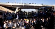 Main image for Escalating Haredi Anti-Draft Protests Shut Down Geha-Zabotinsky Interchange with Reports of Grenades and Smoke on Roads.