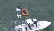 Main image for Paddleboarders Swept Out to Sea Rescued Using Umbrella as Sail.