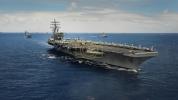 Massive Display of American Power: USS George H.W. Bush Conducts Intense Flight Operation in Strategic Waters.