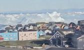 Main image for Watch: Massive Iceberg Suddenly Capsizes Off Greenland's Icy Coastline.