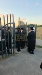 The Toldos Aharon Rebbe Shlit"a wishing Hagaon Hechasid R' Yosef Chaim Greenwald Shlit"a "gepoilt alles guts" after the Hisorerus Rachamim gathering at the tziyon in Liska