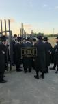 The Toldos Aharon Rebbe Shlit"a wishing Hagaon Hechasid R' Yosef Chaim Greenwald Shlit"a "gepoilt alles guts" after the Hisorerus Rachamim gathering at the tziyon in Liska