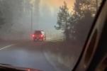Main image for Chilling Video Shows Flames and Burning Homes as Family Flees Canada Wildfire.