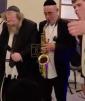 Main image for Rosh Yeshiva R' Sholom Ber Sorotzkin Takes the Stage and Begins Singing "Utzu Eitza V'sufar"