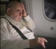 Main image for Rosh Yeshiva HaGaon Rav Salim Shlit"a Engrossed in Learning on a Laptop on the Plane, En Route to a Keren Olam HaTorah Trip in Mexico and Panama