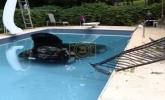 Main image for Car Fully Submerged in Pool Following Steep Driveway Crash.