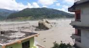 Main image for 4,000-FOOT DROP: Video Shows Colossal Boulder Tumbling in Nepal Flood Disaster