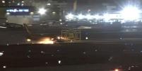Main image for TERRIFYING: DHL Cargo Jet Erupts in Flames After Brake Lockup on LAX Runway