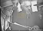 Main image for A Rare Video of Yeshivas Ponevezh in Lithuania in Tarztzav, Showing HaGaon Rav Yosef Shlomo Kahaneman ZT"L Engaged in a Pilpul With the Talmidim.