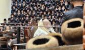 The Vizhnitzer Rebbe Shlit"a at Selichos Rishonos in the Beis Medrash HaGadol, Wrapped in a Tallis Inherited From His Grandfather, the Imrei Chaim of Vizhnitz ZY"A.