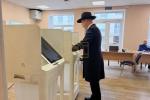 Main image for Russian Chief Rabbi Lazar Casting His Vote in the National Parliamentary Elections, Despite the Tirdos Hachag.