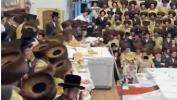 Main image for Thousands of Chassidim in Toldos Aharon Sing the Special Hamavdil for Motzaei Yom Kippur at the Rebbe's Tish.