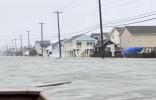 Main image for STREETS BECOME RIVERS: Man Steers Motorboat Through Flooded Jersey Shore Street In Wild Video