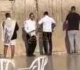 Main image for Ki B'Simcha Tzeitzeiu: Two Yidden Break Into a Dance at the Kosel Before Leaving Eretz Yisroel