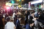 Until Dawn: Tens of Thousands of Yidden Rejoice in the Simchas HaChag at the Central Simchas Beis Hashoeiva on the Streets of Crown Heights in Front of Central Chabad Headquarters
