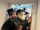 The Dushinskya Rebbe Shlit"a at a Kvias Mezuzah at the New Chaverim Headquarters in Williamsburg