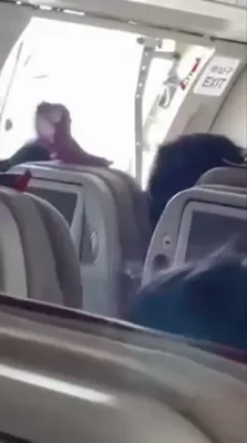 A mentally unstable person opens an airplane door mid landing 