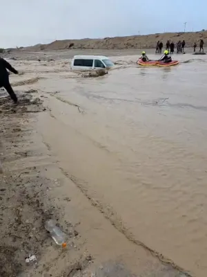 Israeli Firefighters Rescue Family Trapped by Flooding on Route 80.