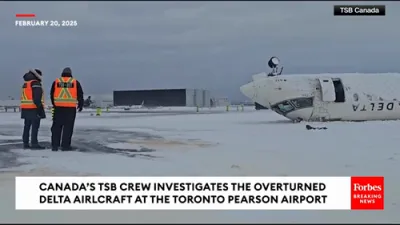 Transportation Safety Board Crew Investigates Overturned Delta Flight At The Toronto Pearson Airport