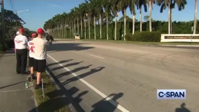 Trump waves to supporters outside Trump International Golf Club
