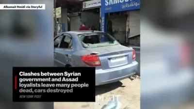 Clashes Between Government Forces and Assad Loyalists Leave Dozens Dead and Cars in Ruins