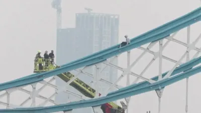 Emergency Services Save Man Climbing Railings in London's Tower Bridge.