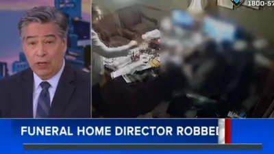 Manhunt Underway for Suspect who pretends to need to Plan Funeral before Robbing and Attacking Director. 