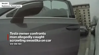 Tesla owner confronts man allegedly caught scrawling on car