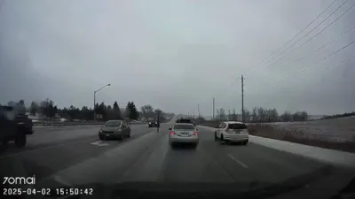 Close Call: Firetruck Narrowly Avoids Collision with Car.