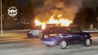 Man With Metal Bat Confronts LAFD at Fiery Van Crash in South Los Angeles