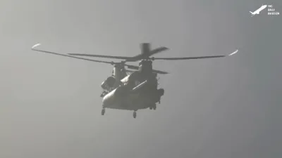 Watch US Soldiers Launch into Water from Helicopters.