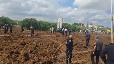 Ballistic Missile Strikes Near Ben Gurion Airport, Leaving Crater in Israel.