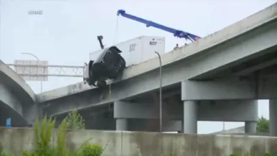 Semi-Truck Driver Dangling Off Bridge Rescued in Dramatic Operation After Louisville Crash.