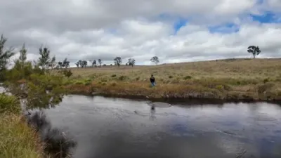 Man Jumps Into River to Wrestle Monstrous Catch.