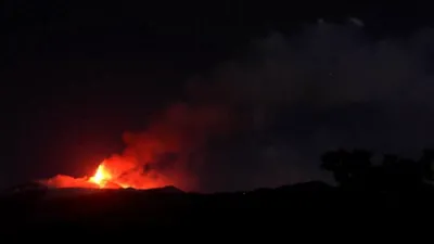 Lava Flows and Explosion Light Up as Mount Etna Erupts Again.
