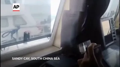 China Blasting the Philippine Coast Guard with Water Cannon. 