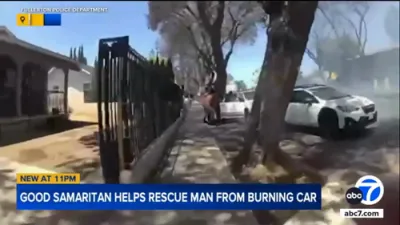 Good Samaritan and Cop Pull Man from Burning Car.