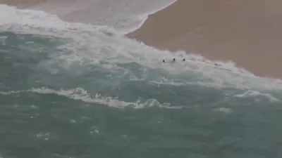 Drone Captures Giant Wave Swallowing Swimmers on Mexican Beach. 