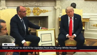 Trump Receives Grandfather's 1869 German Birth Certificate from Chancellor Merz in Oval Office.