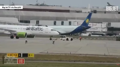 Man Sprints Across Tarmac Near Moving Plane. 