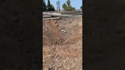 Massive Crater Left in Herzliya After Iranian Ballistic Missile Strike. 