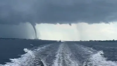 Captures Stunning Twin Waterspouts at Sea.