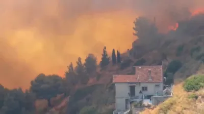 Raging Wildfire Forces Evacuations and Shuts Down Airport in Southern France. 