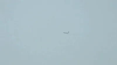 Plane Airdrops Humanitarian Aid Over Central Gaza Amid Ongoing Conflict.