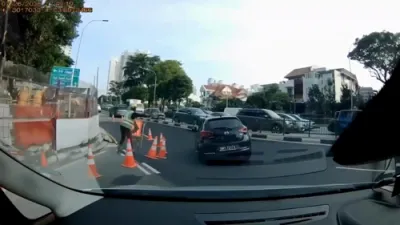 Car Plunges Into Sinkhole on Tanjong Katong Road South, Singapore.