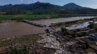Beijing Floods Shatter Bridge, Bury Villages in Mud After Record Rainfall. 