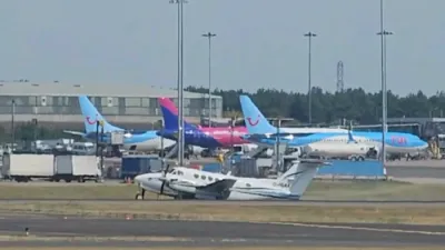 Plane Skids Down Runway During Emergency Landing.