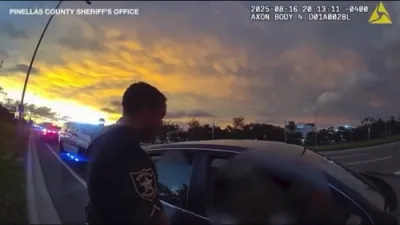 Mario Kart in Backseat as Cop Hitches Ride to Arrest Suspect.